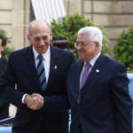 Israeli Prime Minister Ehud Olmert meets with French President Nicolas Sarkozy and Palestinian Authority Minister Mahmoud Abbas at the Elysee Palace in Paris