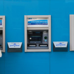 Man cashing out money from Bank Leumi machine. Photo by Nati Shohat/Flash90