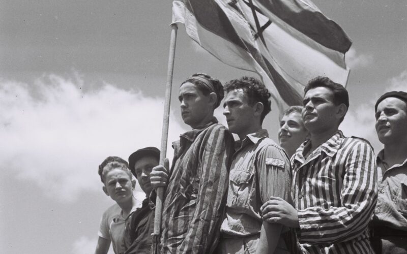 A GROUP OF FORMER BUCHENWALD INMATES ON BOARD THE REFUGEE SHIP "MATAROA" IN HAIFA PORT