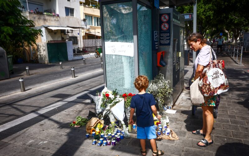 People at the site of the deadly terror shooting attack in Jaffa