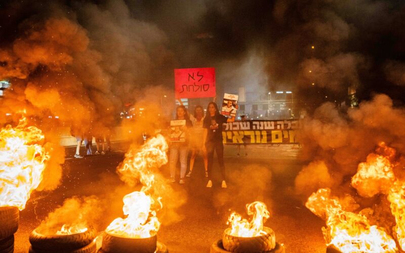 Families of Israelis held kidnapped by Hamas terrorists in Gaza and activists block the Ayalon Highway in Tel Aviv