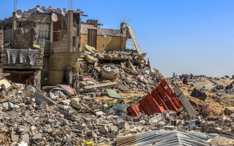 Palestinians live among the rubble of their homes